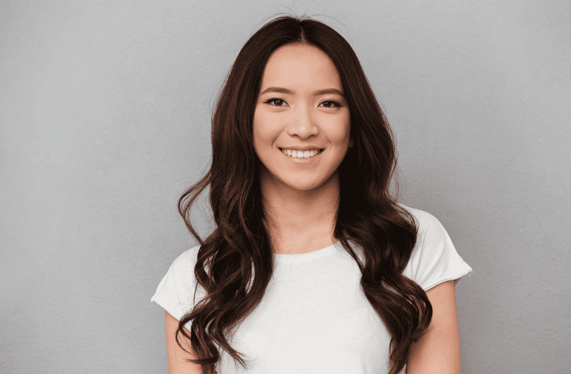 Facial Nerve Paralysis: Young asian girl smiling at the camera