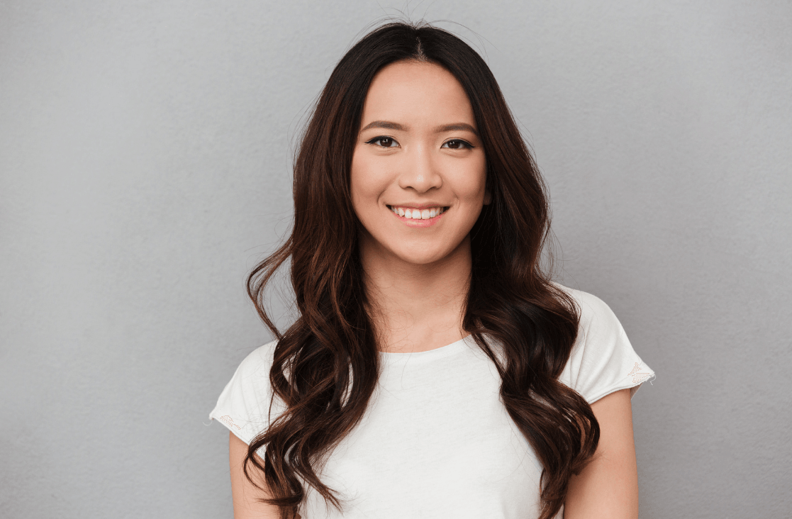 Facial Nerve Paralysis: Young asian girl smiling at the camera