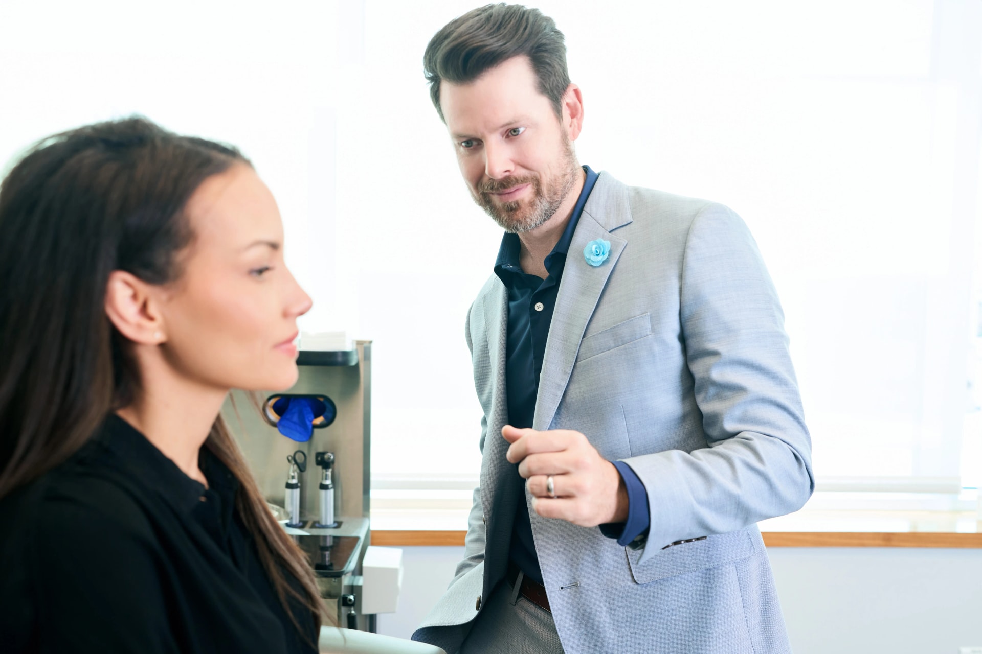 Facial Scar Treatment: Dr. Bader doing a consultation with a young female patient