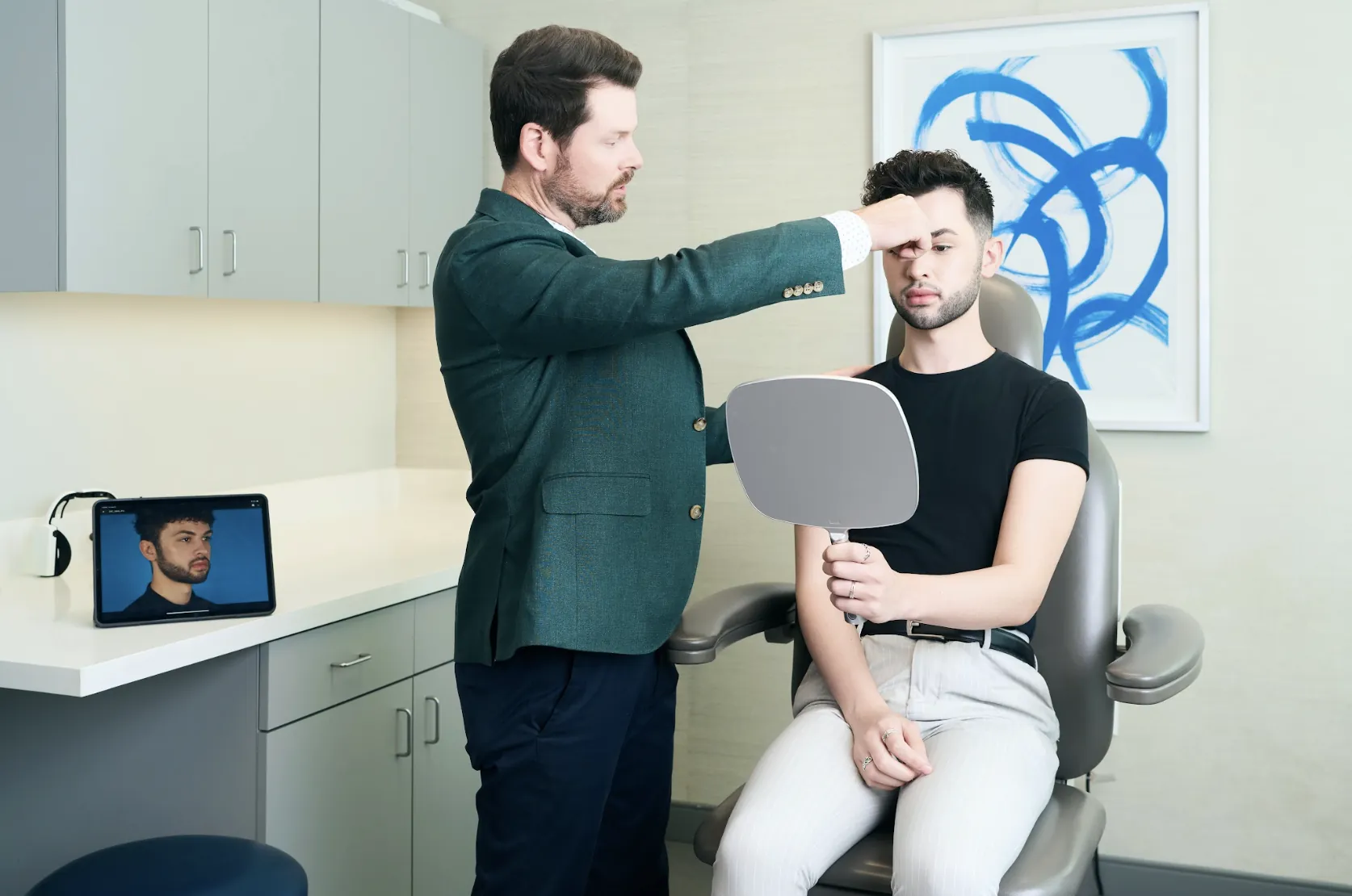 Teen rhinoplasty: Surgeon evaluating a teenage patient’s nose shape during an in-office consultation