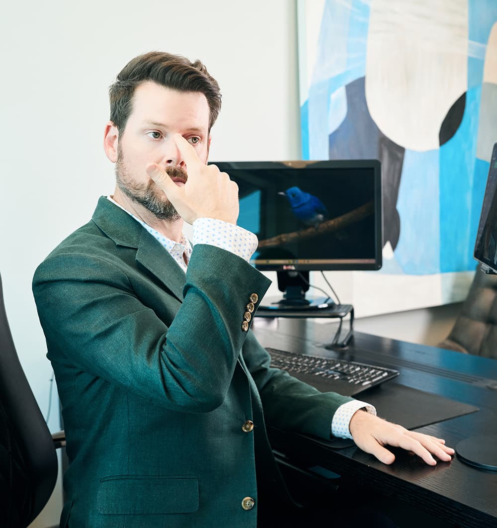 Ethnic Rhinoplasty: Male patient consultation showing nasal bridge evaluation with surgeon