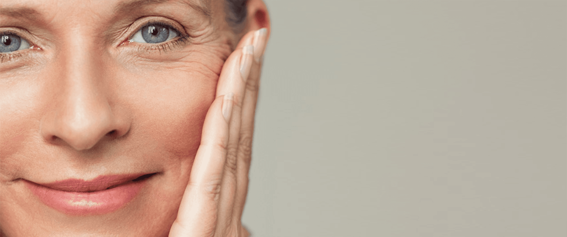 Facial Nerve Paralysis: Close-up od older woman smiling at the camera