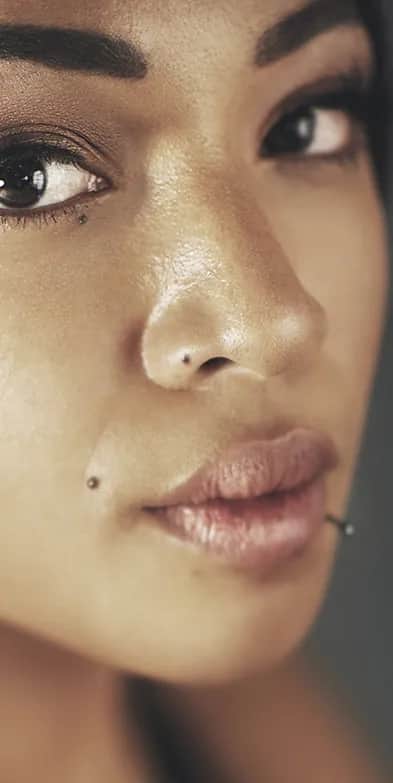 Ethnic rhinoplasty: Close-up portrait of a woman with natural features and defined nasal profile