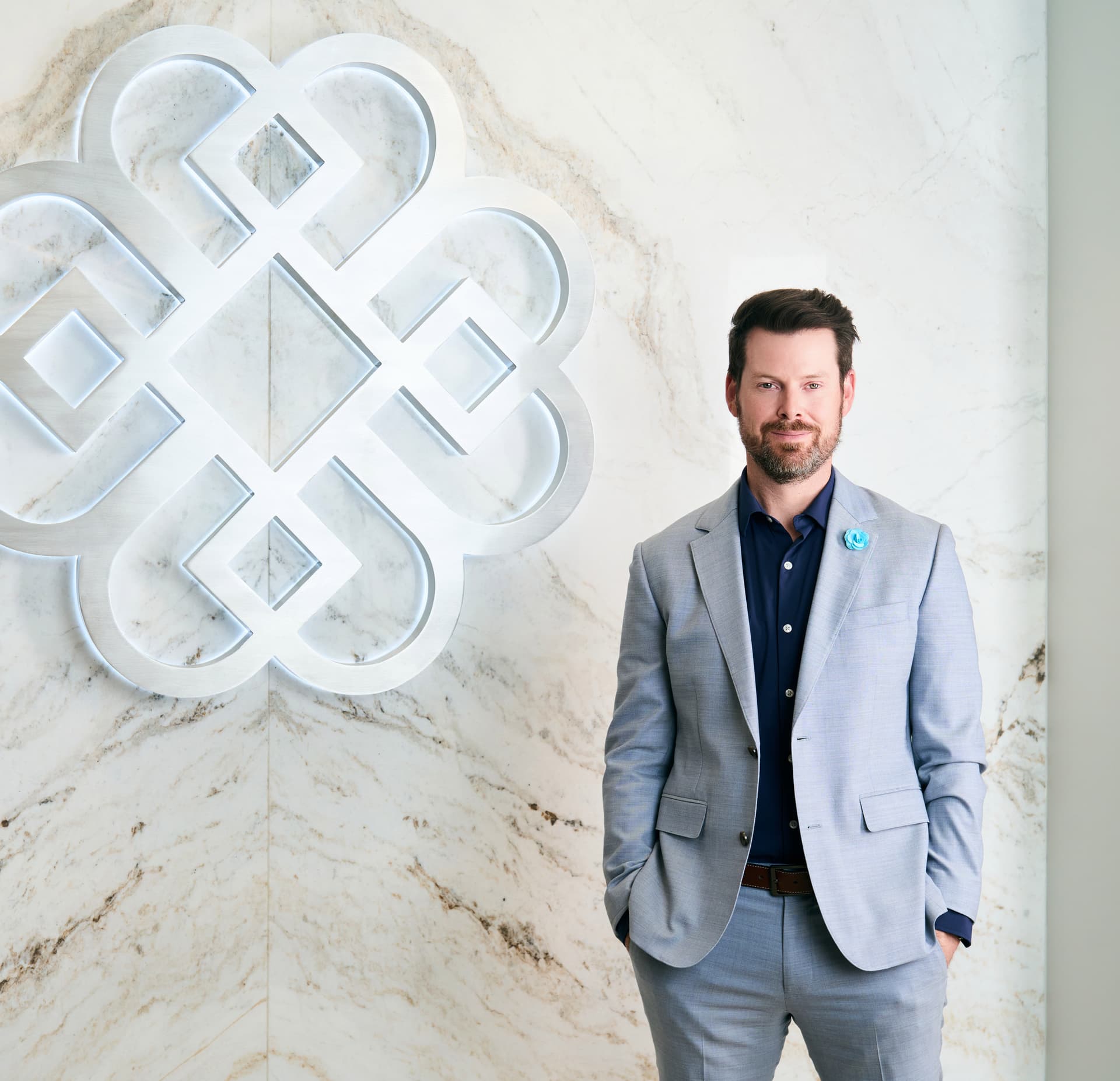 Liquid Facelift: Dr. Bader standing next to his logo