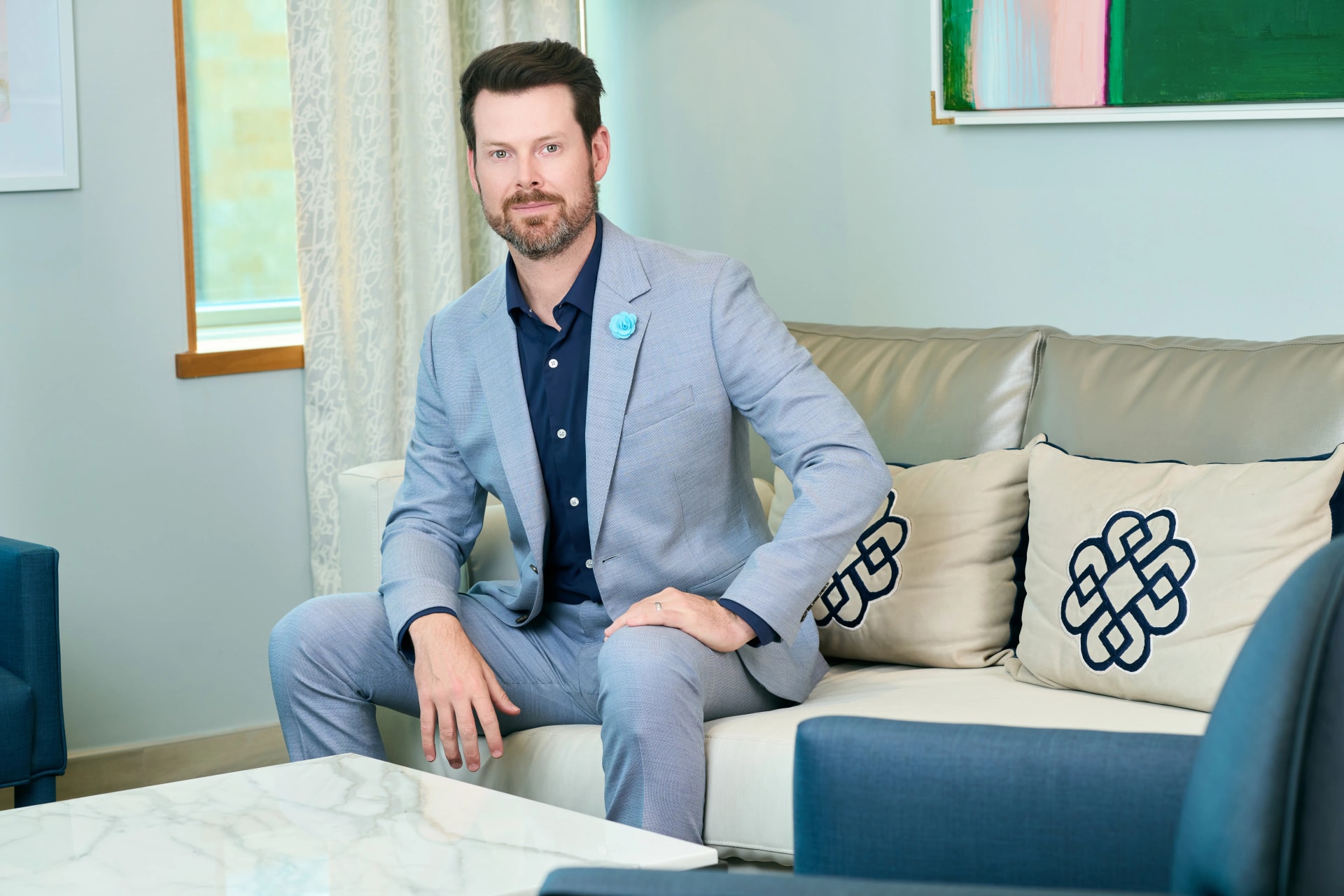 Facial Wrinkles Plano: Dr. Bader sitting on a couch in his office