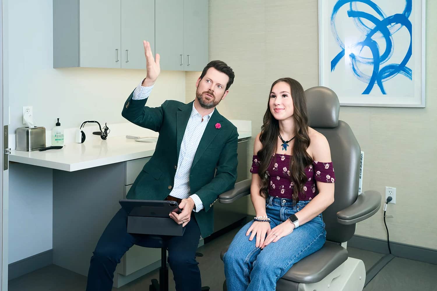 Crooked nose: Surgeon discussing nasal concerns with a female patient during consultation