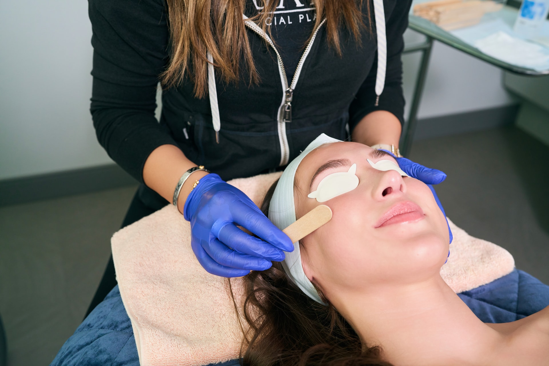 Chemical Peel: Skincare provider applying facial peel treatment