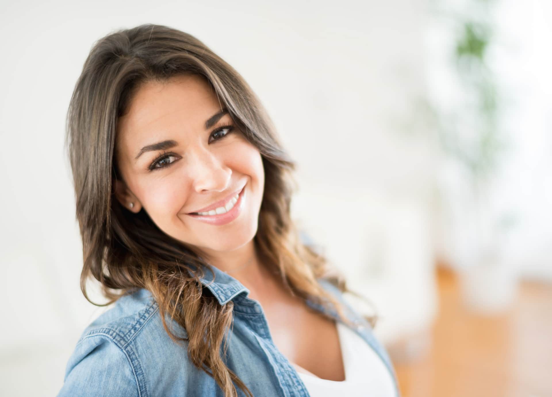 Chemical Peel: Woman smiling with bright skin and even complexion