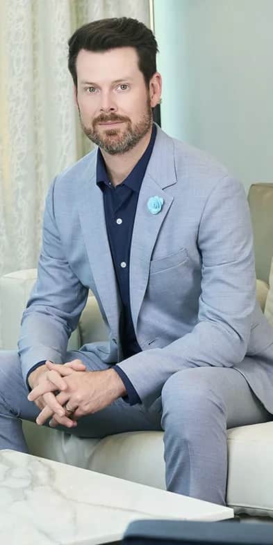 Looking for Solutions? Dr. Bader Treats: Dr. Bader sitting in his clinic lobby, welcoming patients