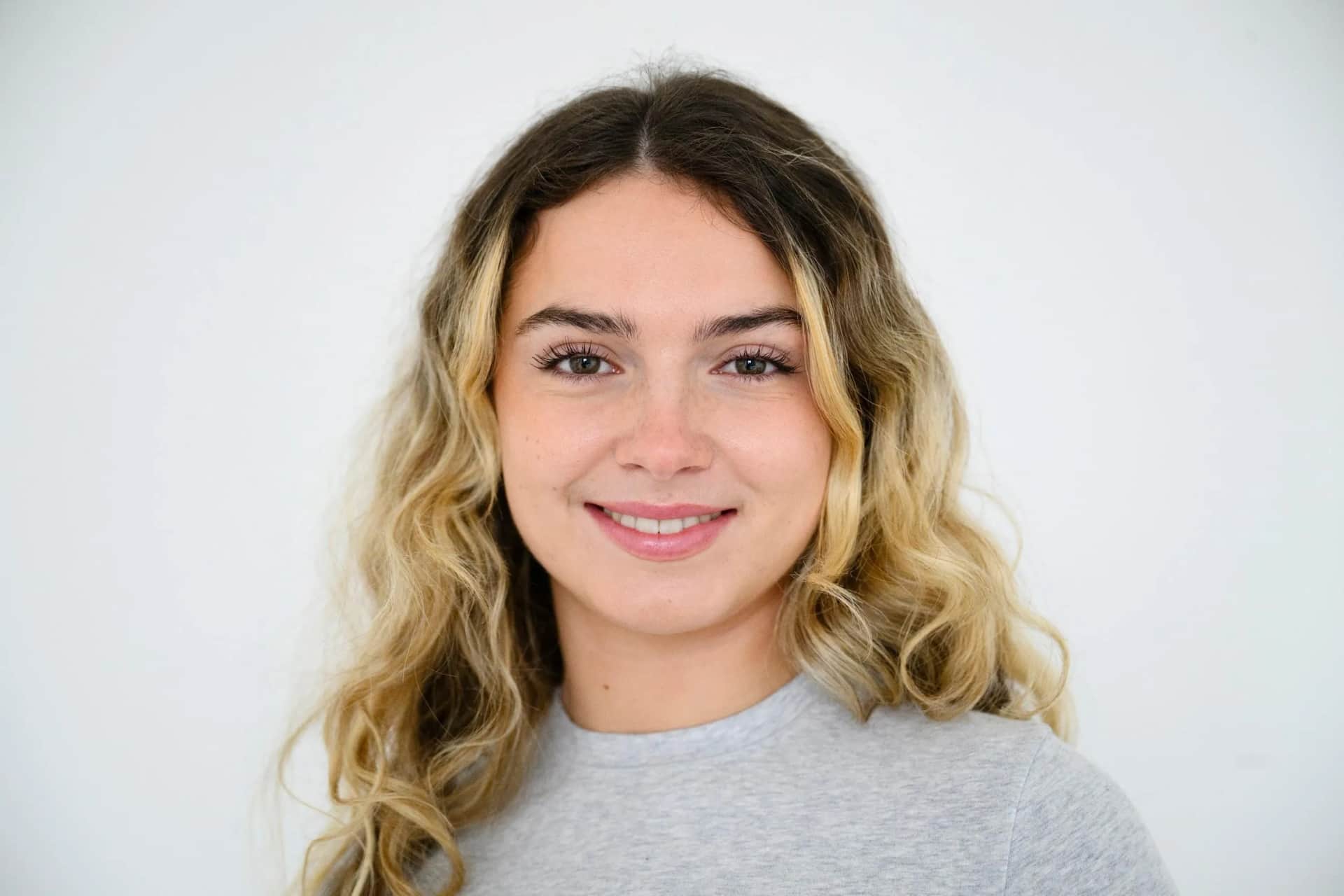 Facial consultation: Young female patient portrait with natural nose structure and relaxed expression
