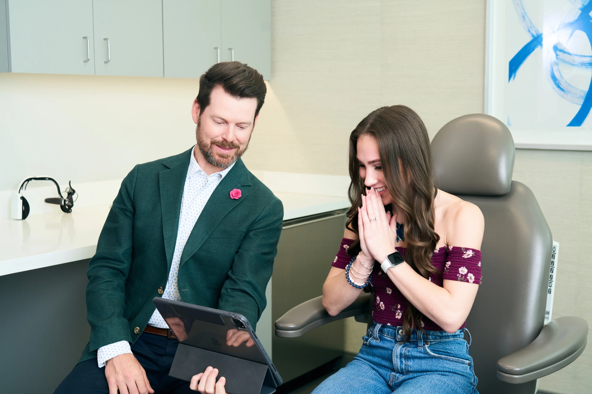 Nasal Reconstruction: A patient with a positive expression consulting with a facial plastic surgeon, reviewing their potential results.